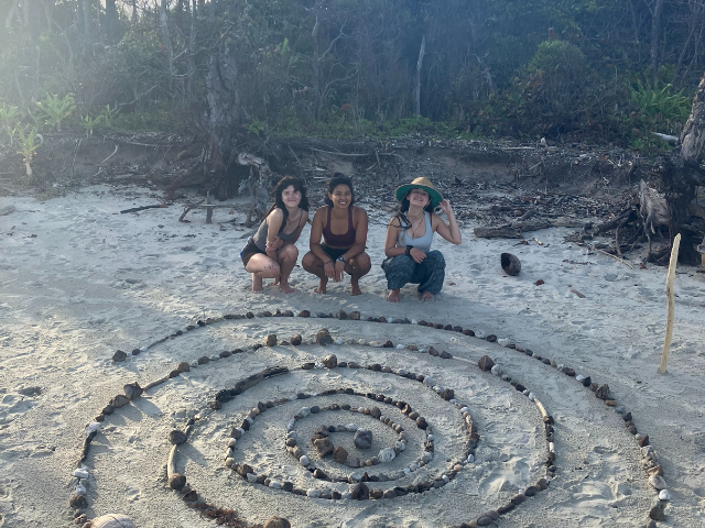 three students and a rock path gray earth