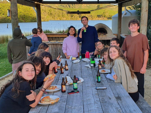 eating at the bench with friends pizza